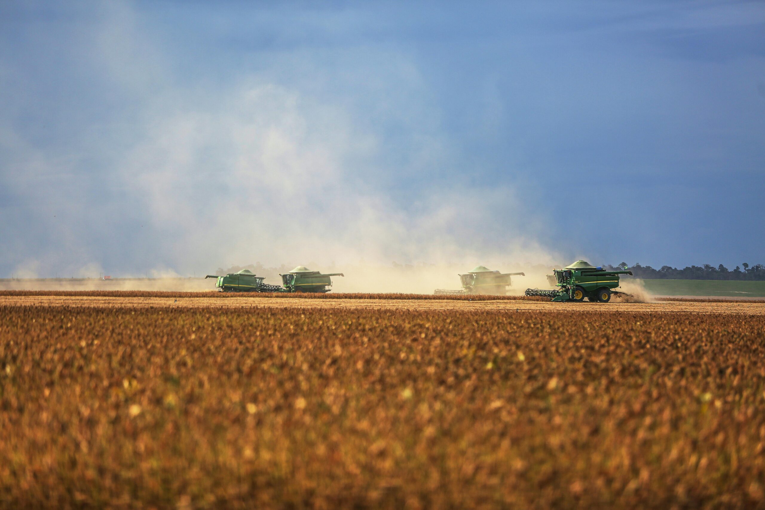 Wide shot of soybean harvesters working in Paragominas, Brazil, capturing agricultural activity.